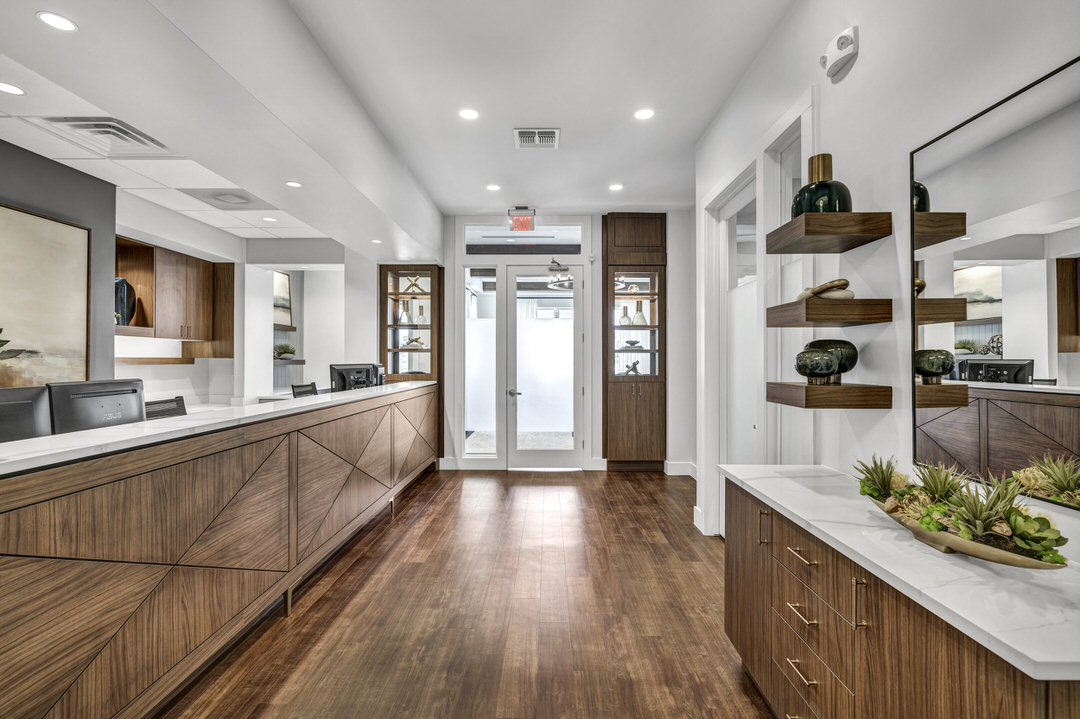 gorgeous front desk area of a redesigned dental office